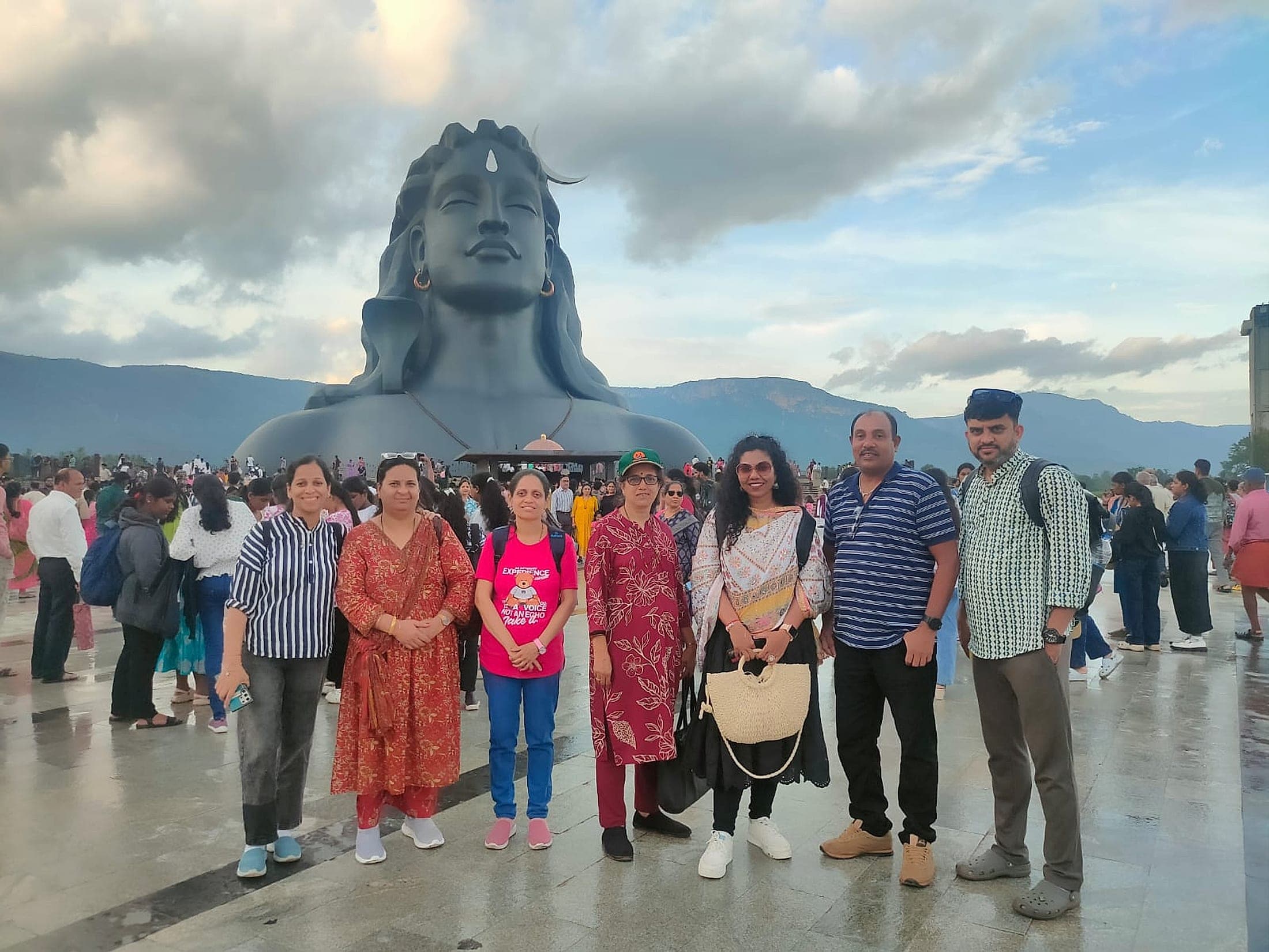 A group of adult travellers on an Explore Unexplored trip, photographed together at the Adiyogi statue in Coimbatore
