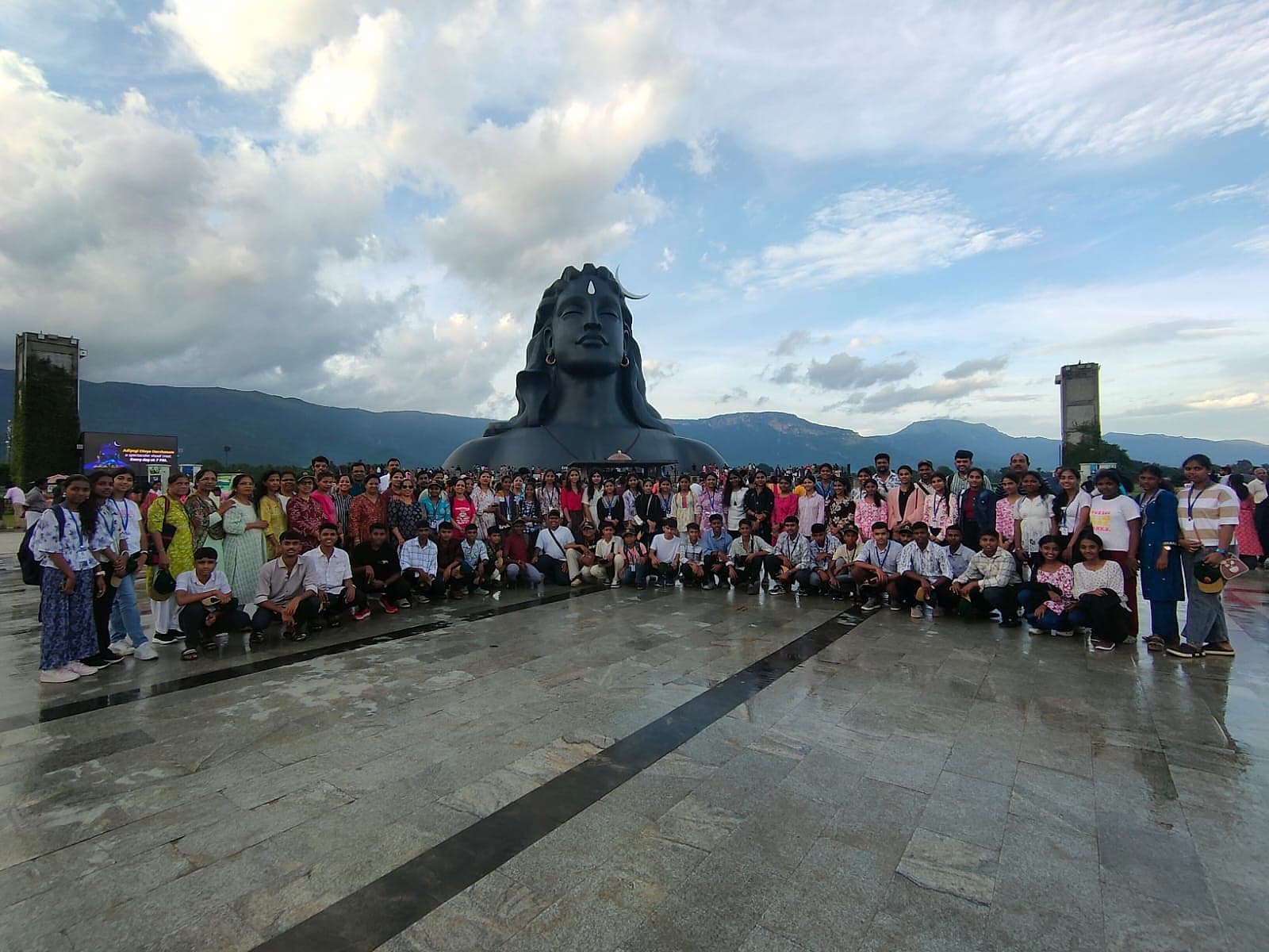 A large seated cohort of students at the end of a day out